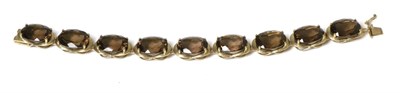 Lot 292 - A 9 carat gold smokey quartz bracelet