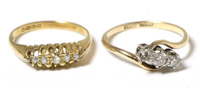 Lot 299 - An 18 carat gold three stone diamond ring in a crossover setting together with a five stone diamond