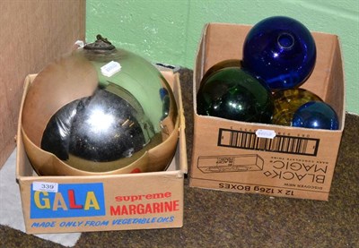 Lot 339 - Silvered witch's ball, together with three green glass and two blue glass bowls