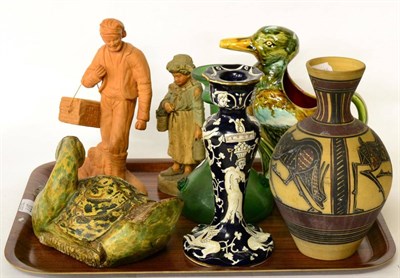 Lot 377 - A Majolica style duck jug; a terracotta figure of a fisherman; a carved wooden duck and four...