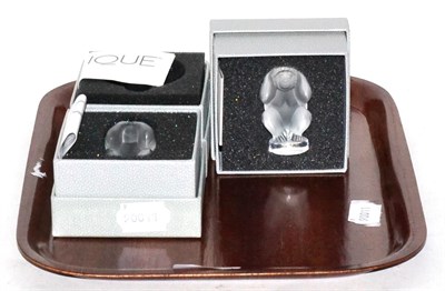 Lot 393 - Three Lalique glass monkey paperweights with boxes and booklets