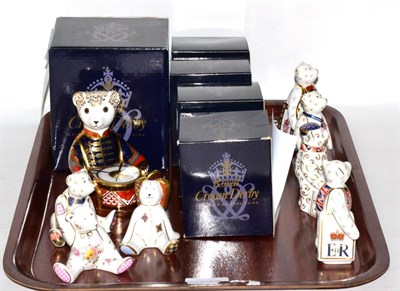 Lot 397 - Eight Royal Crown Derby bear paperweights consisting of 'Seated Drummer Bear' (with box),...