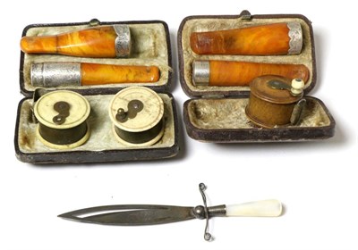 Lot 419 - Three miniature tape measures in the form of fishing reels; silver and mother-of-pearl bookmark...