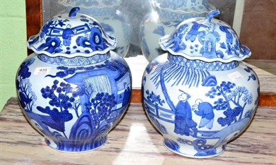 Lot 435 - A pair of Chinese blue and white jars and covers, 20th century, marks to base, floral design