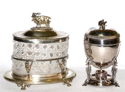 Lot 472 - A silver plated cut glass biscuit barrel and a egg coddler