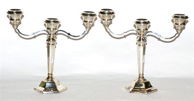 Lot 473 - Pair of silver three light candelabra