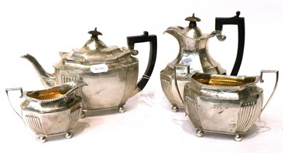 Lot 481 - An Edwardian silver four piece tea service, Elkington & Co, London 1907-09, shaped oval with...