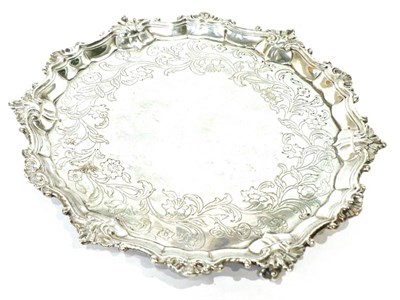 Lot 483 - A George III silver salver, London 1762, 30cm diameter, 30.8ozt (extensive repairs)