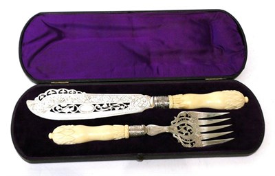 Lot 488 - Twelve pairs of electroplated fish knives and forks with ivory handles, late 19th century, in a...