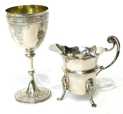 Lot 500 - A Victorian silver goblet, William Smily, London 1865, with bead borders; and a silver cream jug of