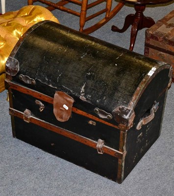 Lot 1072 - A dome toped trunk, with leather carrying handles