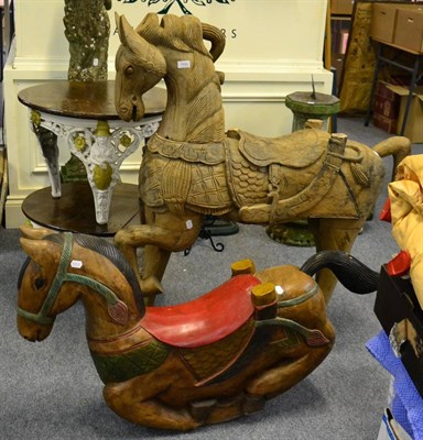 Lot 1083 - Two carved wood horses