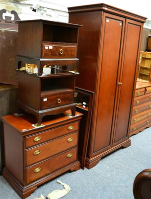 Lot 1095 - A reproduction mahogany wardrobe, with a matching chest of drawers, a pair of Stag bedside...