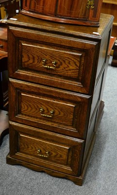 Lot 1097 - A reproduction oak three height filing cabinet