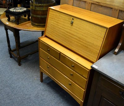 Lot 1105 - An L.M Furniture Limited teak bureau and an oak gate leg table (2)