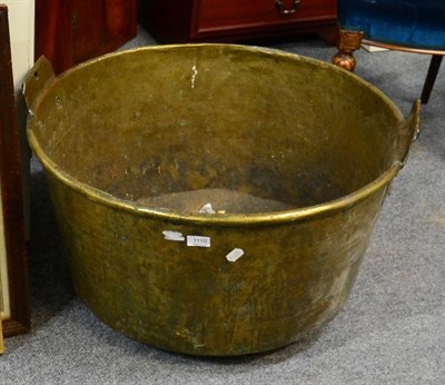 Lot 1110 - A 19th century brass twin handled log bin, diameter 72cm