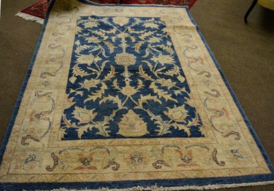 Lot 1148 - Ziegler design rug, North Afghanistan, the mid indigo field of serrated leafy vines enclosed by...