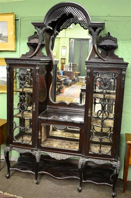 Lot 1243 - Ornately carved mahogany mirrored display cabinet