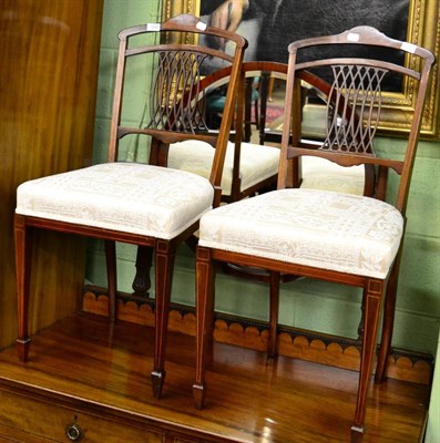 Lot 1247 - A pair of Edwardian inlaid mahogany bedroom chairs