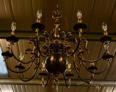 Lot 1259 - A Dutch style ten light chandelier with dolphin carved arms