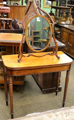 Lot 1261 - A 19th century fold-over tea table, together with a toilet mirror of similar date