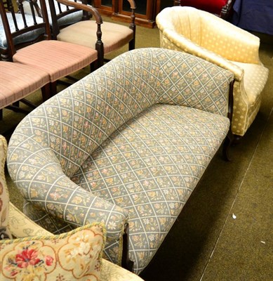 Lot 1292 - Early 20th century tub chair, together with a small two seater low-back sofa of similar date (2)