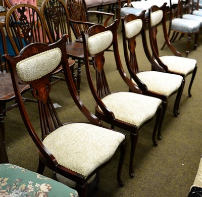 Lot 1299 - Set of four chairs together with a footstool