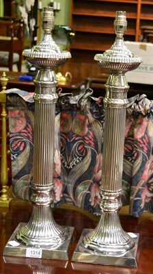 Lot 1314 - A pair of large silver plated table lamps with reeded columns