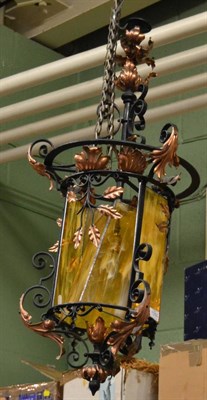 Lot 1350 - Wrought iron and copper lantern with coloured glass panels, together with two lustre drop light...