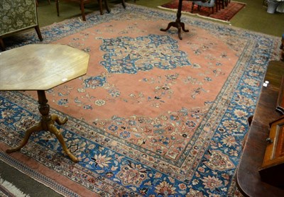 Lot 1358 - Indo-Persian carpet, North India, the pale peach field sparcely decorated with vines around a...