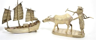 Lot 20 - A Chinese silver model of a junk by Wang Hing together with a Chinese white metal figure of a...