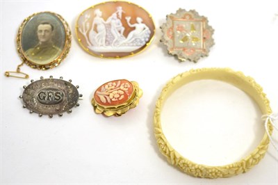 Lot 22 - Two cameo brooches, a portrait brooch, two Victorian silver brooches and an ivorine bangle