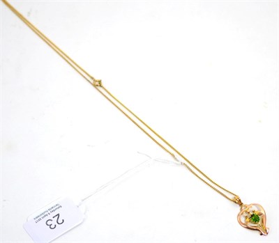 Lot 23 - An Art Nouveau green doublet necklace on chain