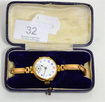 Lot 32 - A lady's 9ct gold cased wristwatch with expanding bracelet
