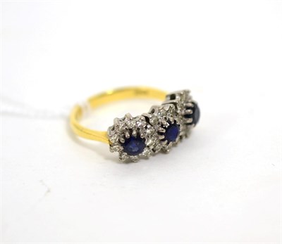Lot 37 - A sapphire and diamond triple cluster ring