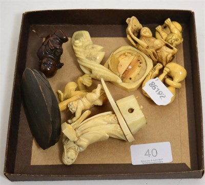Lot 40 - Four Meiji period ivory netsukes, a wooden example and two ivory figures of similar date (7)