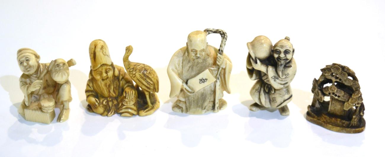 Lot 48 - Five Meiji period carved ivory netsukes, four figural, one landscape with red seal mark (5)