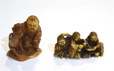 Lot 49 - Two Japanese Meiji period carved netsukes, man and deer, group of three seated men (2)