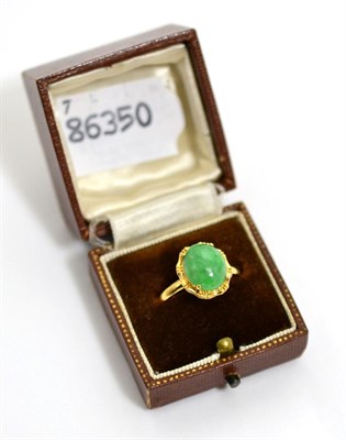 Lot 57 - A gold hardstone set ring, stamped 18K
