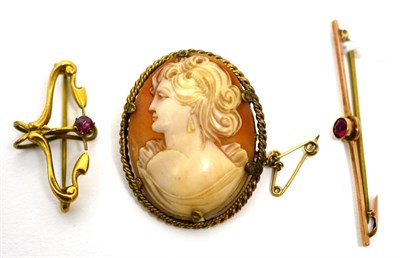 Lot 62 - A Victorian cameo brooch in mount stamped 12ct, an Art Nouveau 9ct gold brooch and a bar brooch...