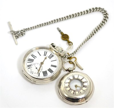 Lot 75 - A silver open faced pocket watch with a silver curb link chain and a silver half hunter pocket...