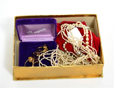 Lot 84 - Four rings and three pearl necklaces