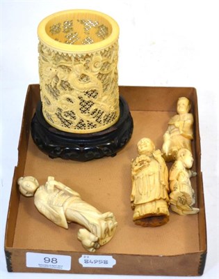 Lot 98 - Four Japanese Meiji period carved ivory figures; together with an ornately carved and pierced ivory