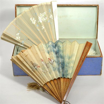 Lot 104 - White ostrich feather fan with mother of pearl guards, four other fans with painted mounts, in...