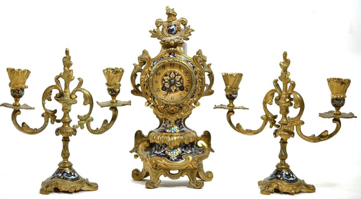 Lot 111 - Gilt metal clock garniture with enamel decoration