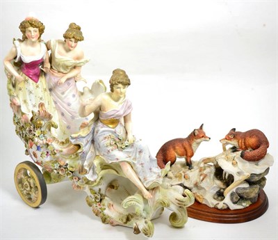 Lot 126 - A continental porcelain centrepiece together with a Border Fine Arts model of foxes