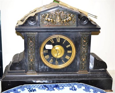 Lot 174 - A gilt metal mounted slate striking mantel clock of architectural form