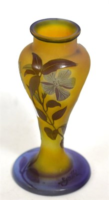 Lot 196 - A Galle style cameo glass vase, cut with butterflies and foliage on a yellow ground, signed in...