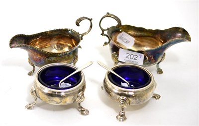 Lot 202 - A pair of Georgian silver salts and two sauce boats