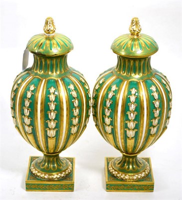 Lot 241 - A pair of green ground vases